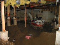 Track Hoe in Crawl Space with Sonotubes.jpg