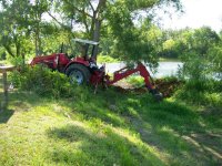 6-18-11 Big RED Beast Mucking Out Island Channel.jpg