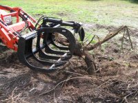 IMG_0190 grapple pulling out small stump.jpg