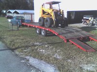 Case 1845 C and 25 foot trailer behind Chevy S 10.jpg