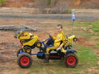 Peytton moving his tractors on his peddel cart,Jan 2007.jpg