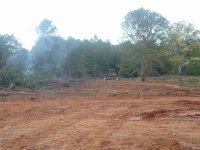 11  Dozer standing by while burn pile smoulders.jpg