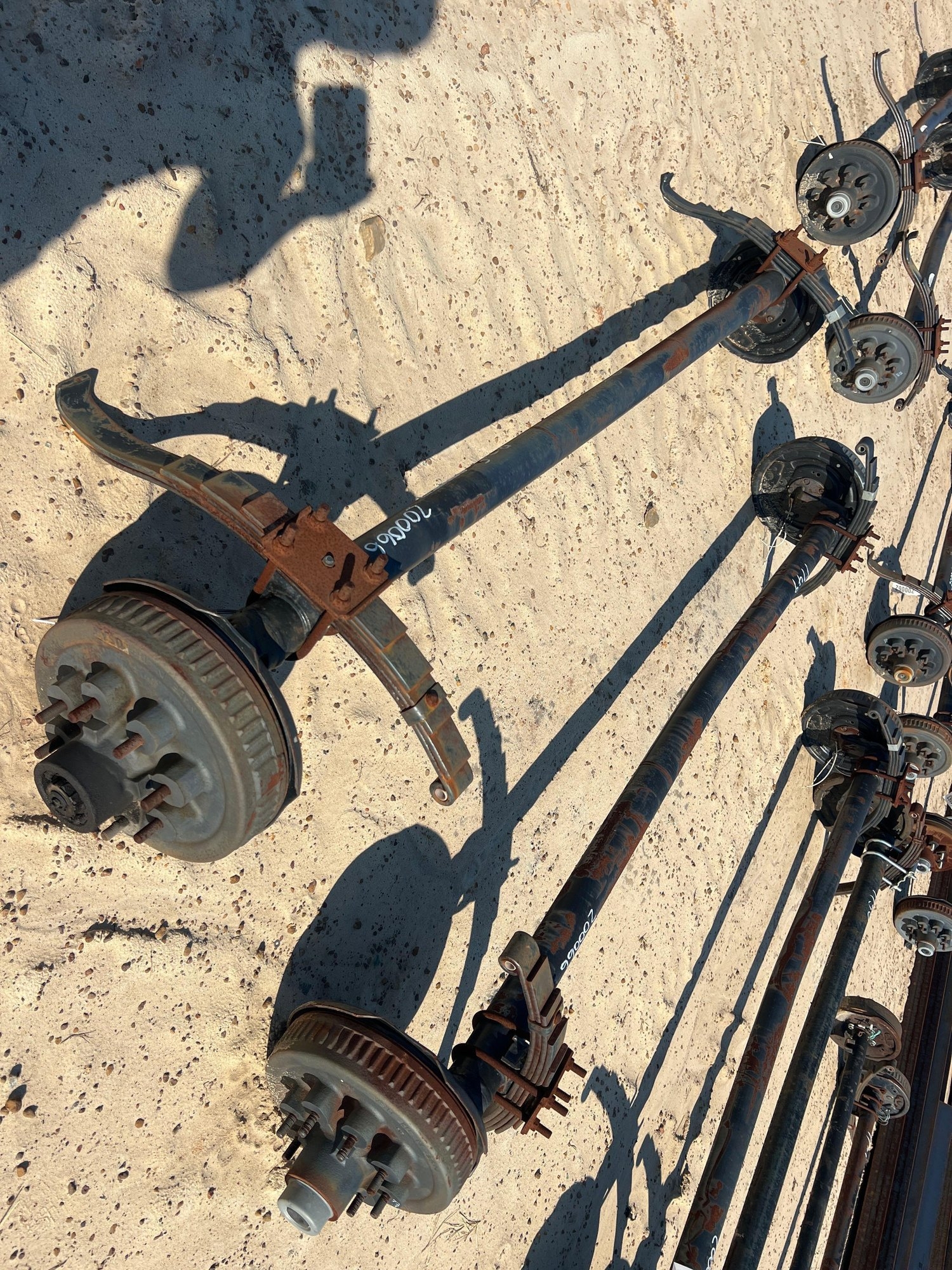 (2) UNUSED 7000# DROP AXLES W/ BRAKES (A51247)