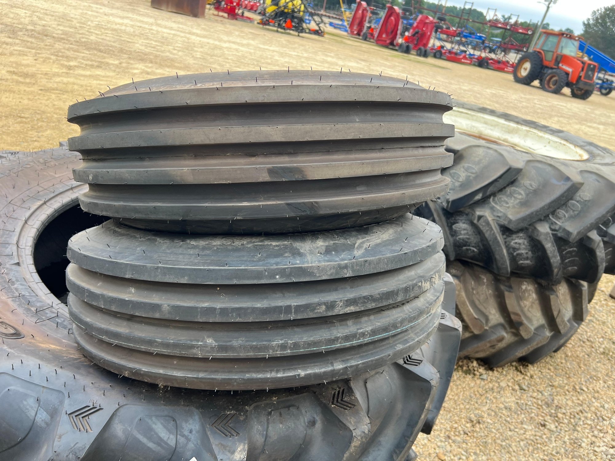 FIRESTONE 9.5L-15 4 RIB TIRES (NEW CONDITION) (A52748)