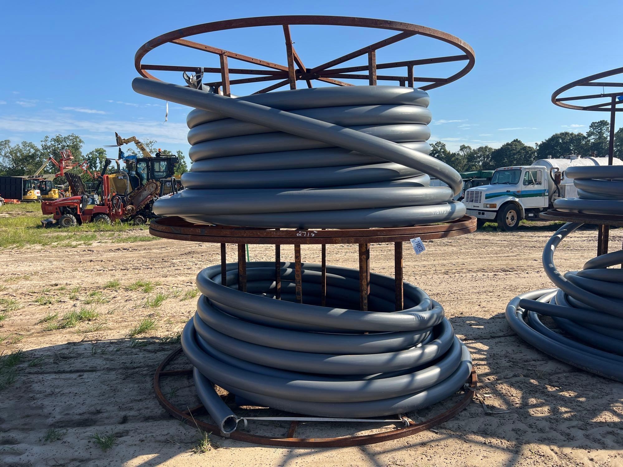 (2) METAL SPOOLS W/ SOME DURALINE 4" PVC PIPE (A51248)