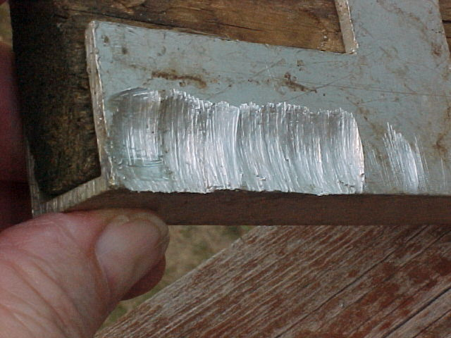 Aluminum piece chewed on by squirrel1 8-2021.JPG