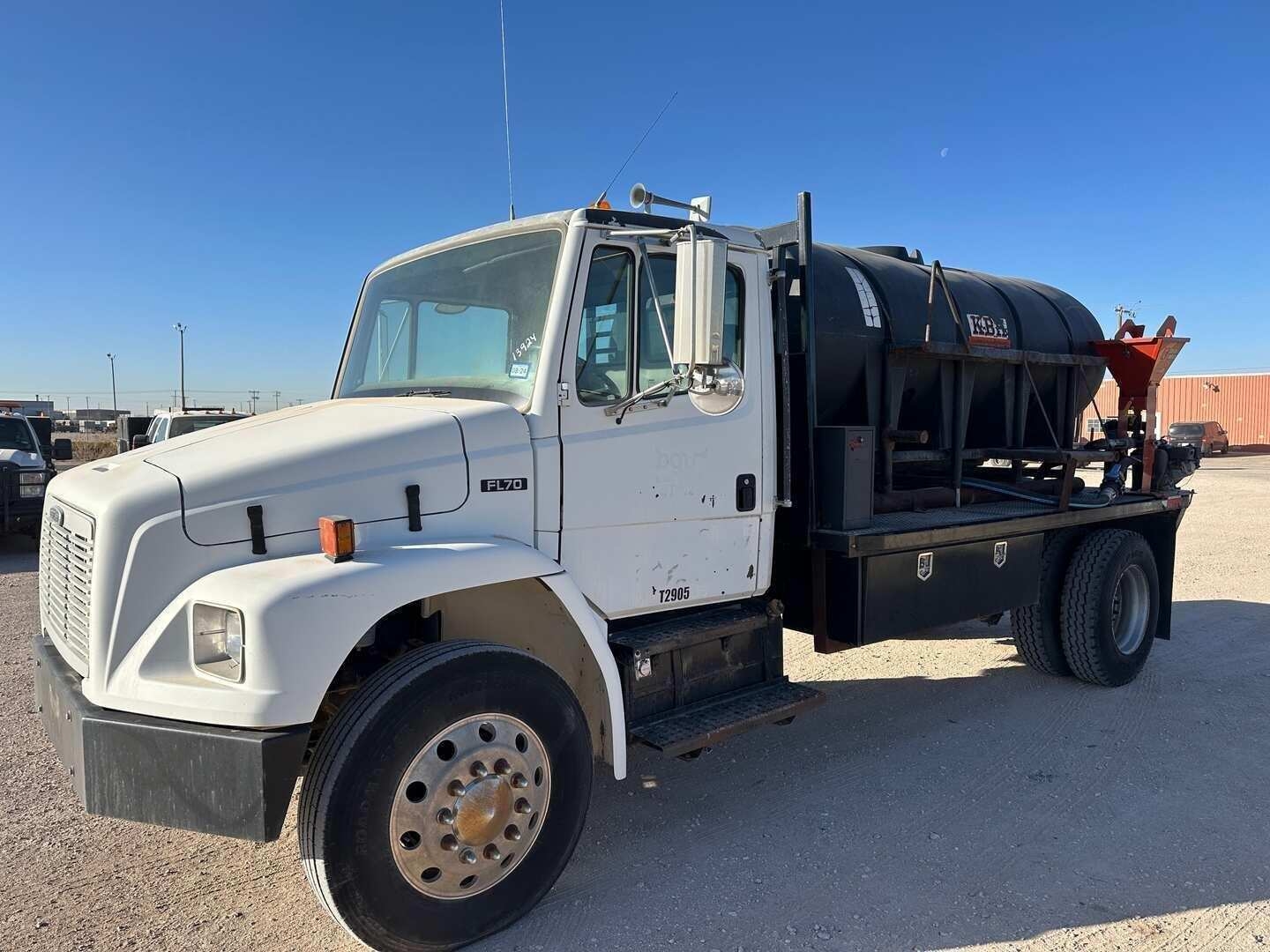 2004 FREIGHTLINER FL70 FLATBED W/TANK & DITCH WITCH MIXER (A48992)
