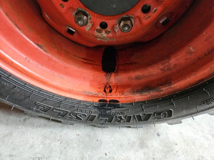 Kubota L3710 left front axle leak.jpg