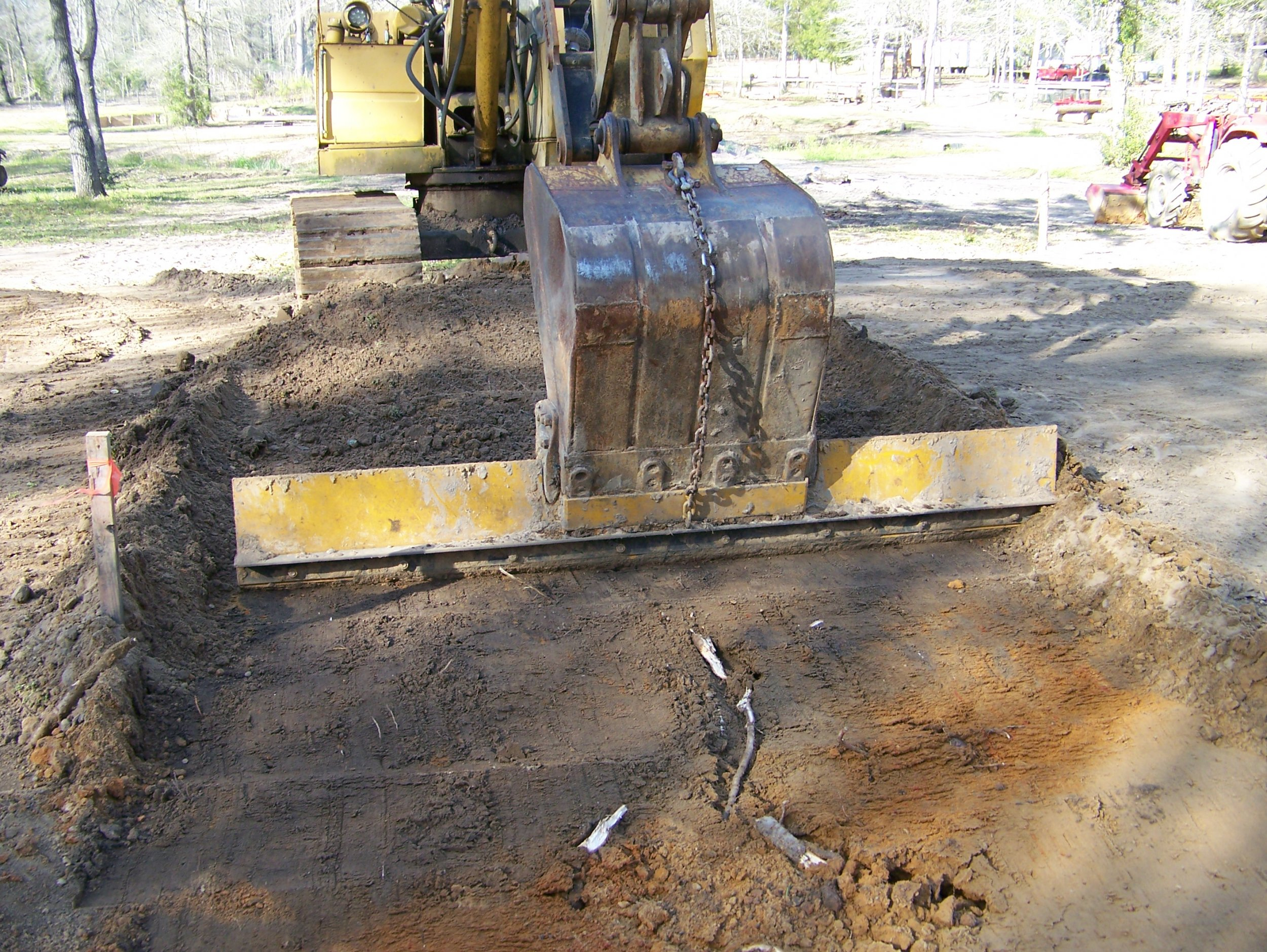 Sawmill Shed CAT Grader Blade Working GREAT.jpg