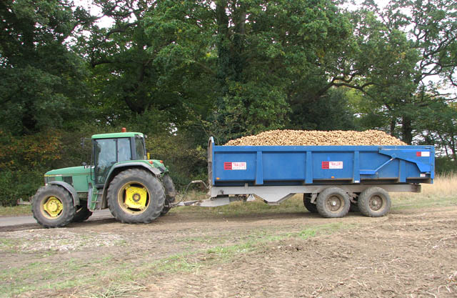 Tractor_and_trailer_pulling_out_of_field_onto_Trumpery_Lane_-_geograph.org.uk_-_1539487.jpg