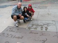 15  Eddie, Peyton & Alissa in front of foot and hand prints.jpg