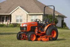 Kubota with guage wheel deck.jpg