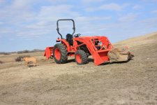 new Kubota with a big rock1.jpg