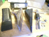 Replacing bucket teeth.JPG