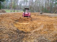 1-2-09 Big RED Beast pushing clay.jpg
