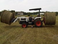 bobcat with bales.JPG