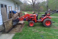 Tractor Digging Concrete SMALL.jpg