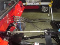 Hydraulicchutedeflector4hosespluggedintotractor.jpg