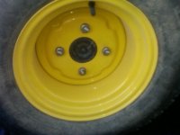 New JD wheel with old lug bolts.jpg