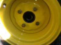 New JD wheel with new tapered head lug bolts and lock nuts on rear.jpg