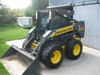 L series new holland skid steer door and enclosure.jpg