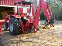 11-25-12 Auger Bit Secured to Backhoe Frame.jpg