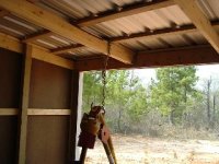 381093-Barn, inside with roof on and post hole digger, Feb 04.jpg