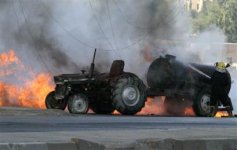515173-burningtractoriraq.jpg