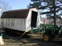 383979-2 Tractor lifting building.jpg