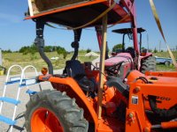 Kubota Canopy Using Board to hold front up.JPG