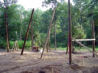 Barn poles waiting concrete.JPG