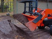 527208-bolt-on grapple - bucket filled with gravel.jpg