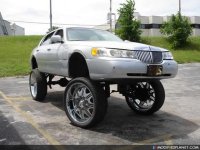 car-photo-1999-lincoln-town-car-donk-lifted-30-inch-wheels.jpg