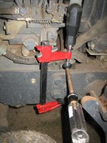 One way to lock driveshaft hub when loosening or tightening bolts.JPG