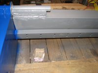 Hinged back resting against 3 in channel iron stop.jpg