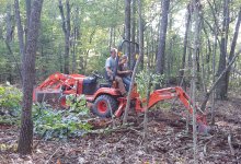 jaime and michelle on backhoe.jpg