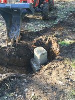 Stump bucket footer hole.jpg