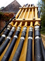 24689570-Hydraulic-pipes-and-hoses-on-the-arm-of-an-excavator-Stock-Photo.jpg