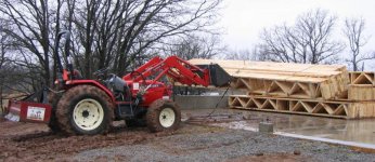 633570-Lifting trusses with tractor (855 x 642).jpg
