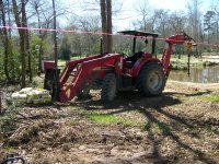2-25-17 Big RED Beast In Fence Post Setting Trim.jpg