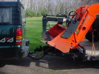 691803-Kubota - hanging over front of trailer.jpg