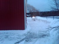 Clearing snow from around the arena.jpg