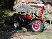 644405-tractorstartingonhillside.jpg