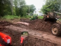 Tractor playing in the mud.JPG