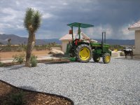 Tractor and front yard rock.jpg