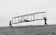 Start-of-a-glide-Wilbur-in-motion-at-left-holding-one-end-of-glider-rebuilt-with-single-vertical.jpg