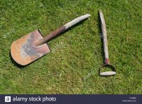 broken-garden-shovel-lying-on-green-grass-F1H88N.jpg