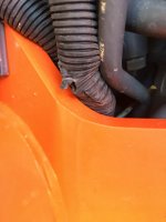 Torn wire protector torn during lower FEL Bracket - Replaced.JPG
