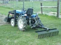 Rake on Tractor.JPG