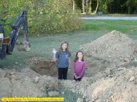 Girls inspecting hole.jpg